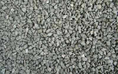 Small crushed grey stone chips of the 6 mm blue metal type, close-up — stock photo