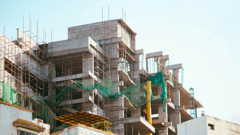Apartment building under construction with scaffolding