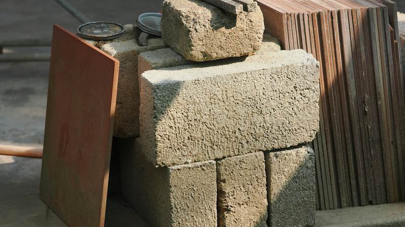 Stack of concrete blocks next to wooden planks