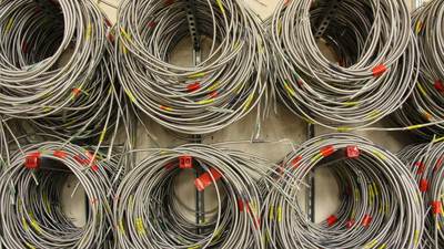 Coils of electrical wire hanging on a wall